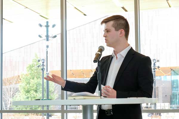 Student gives speach at Business Week event