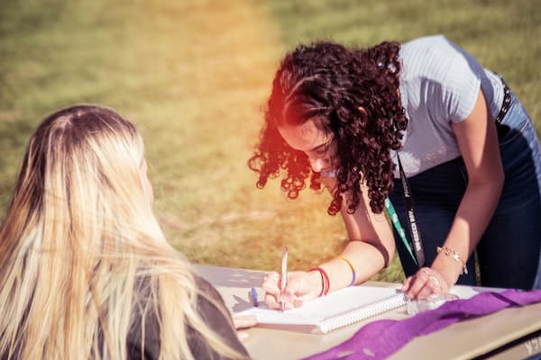 Student signs up for a club at Org Smorg