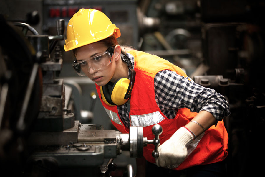 Mechanical Engineering Tech operating a cnc machine in factory