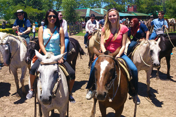 Students riding horses while studying abroad