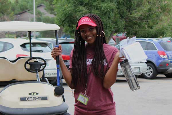 Student employee poses for photo