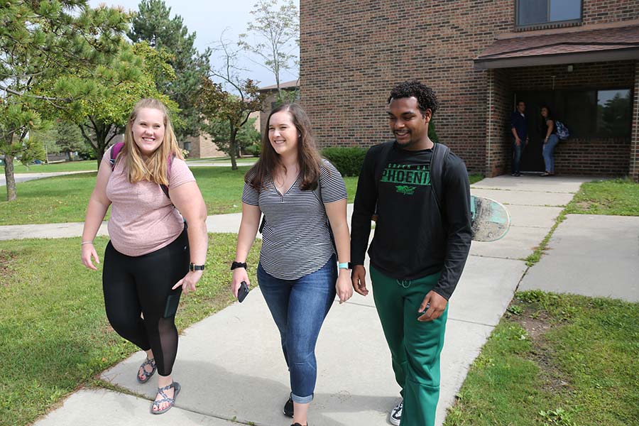 Students walking out of a residence hall