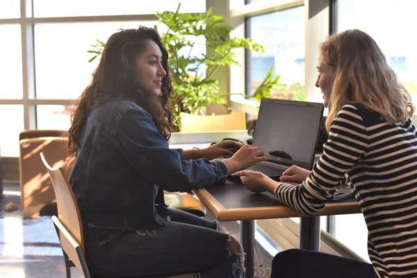 Student meets with advisor for support