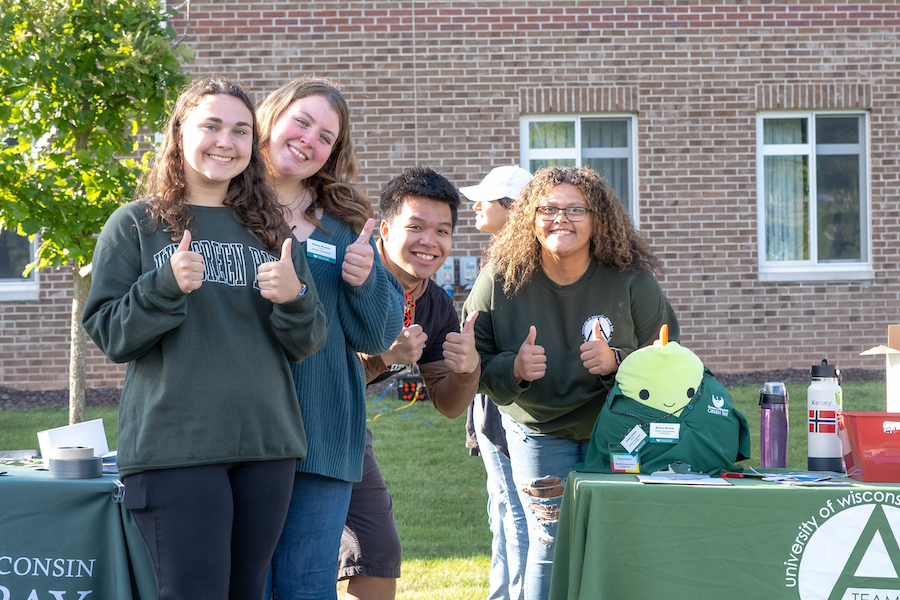 students giving the camera a thumbs-up