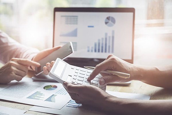 Finance and budget work with laptop and calculator
