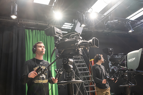 Student using film equipment
