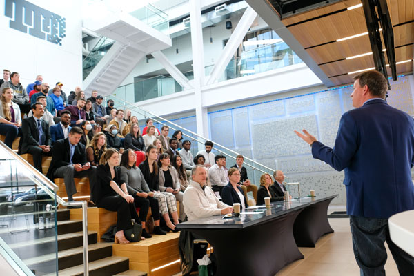 Business man giving speech at Titletwon Tech