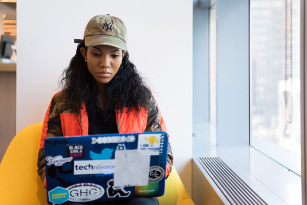 Girl studying at laptop