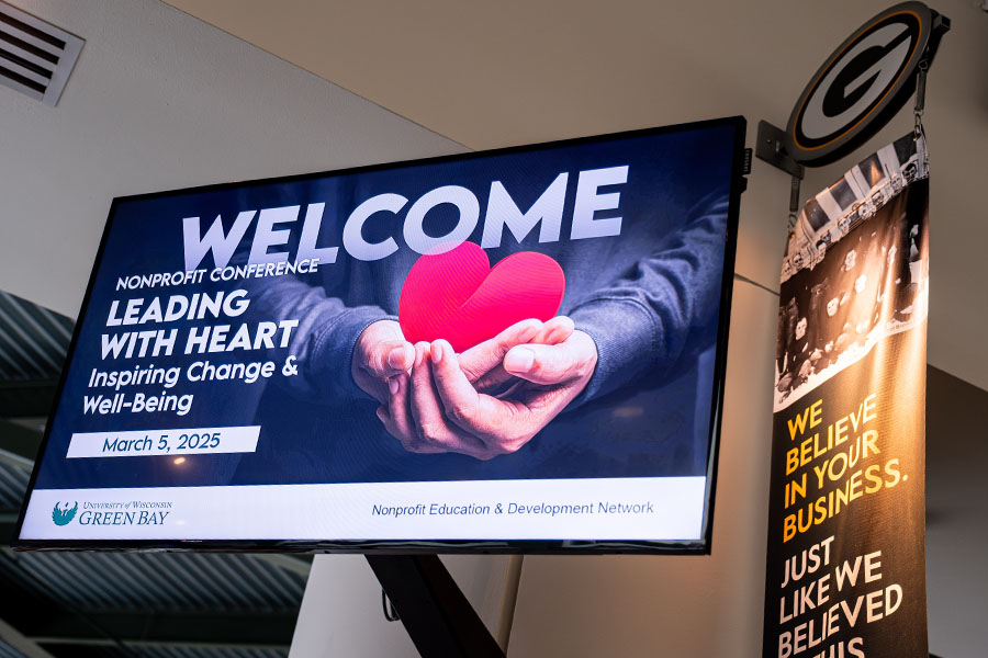 television screen at Lambeau Field showing Welcome to Nonprofit Conference message