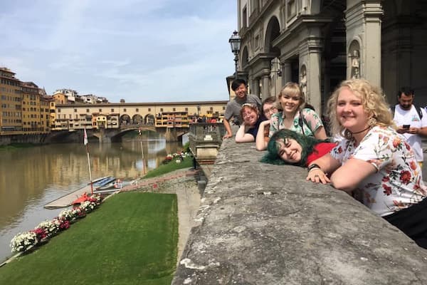 Students pose by historic architecture