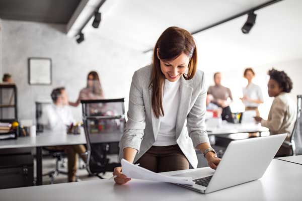 Businesswoman looks over papers