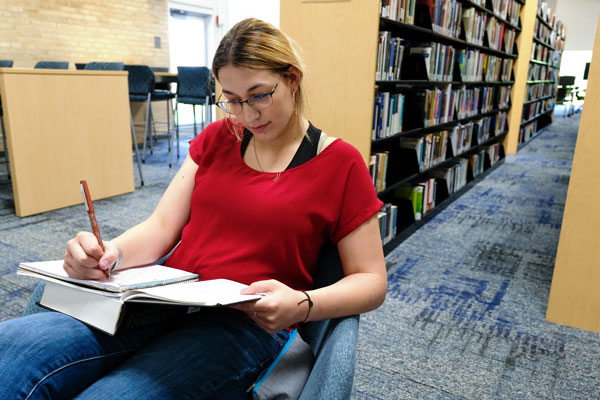Female student studying in library