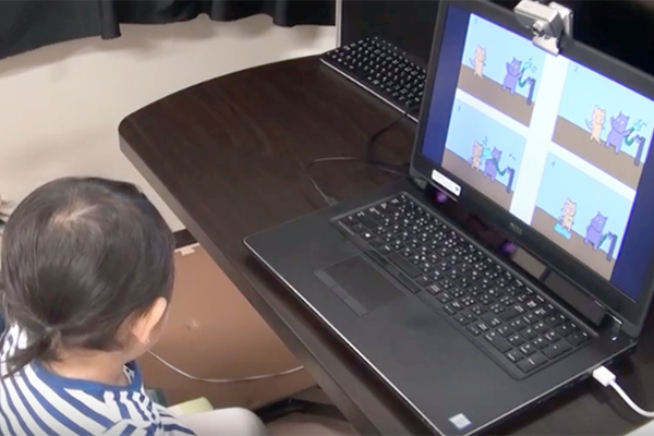 Child watching video on laptop
