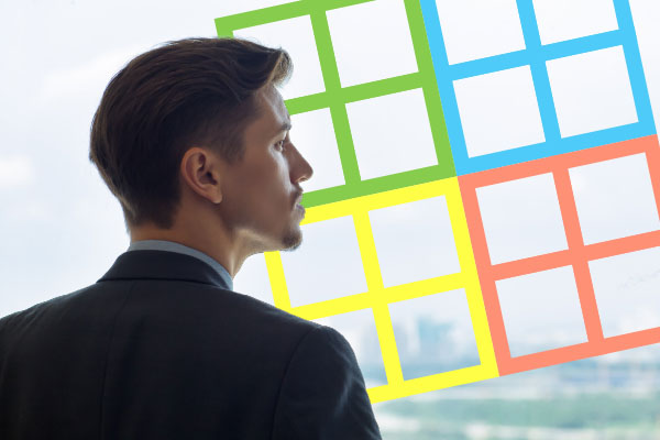 man looking out window with Myers-Briggs matrix
